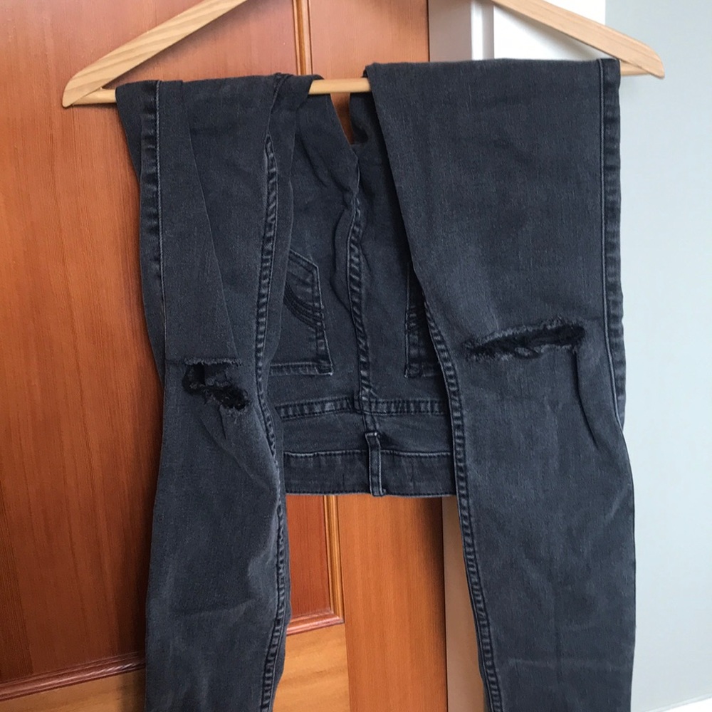 grey hollister jeans with rips in knew